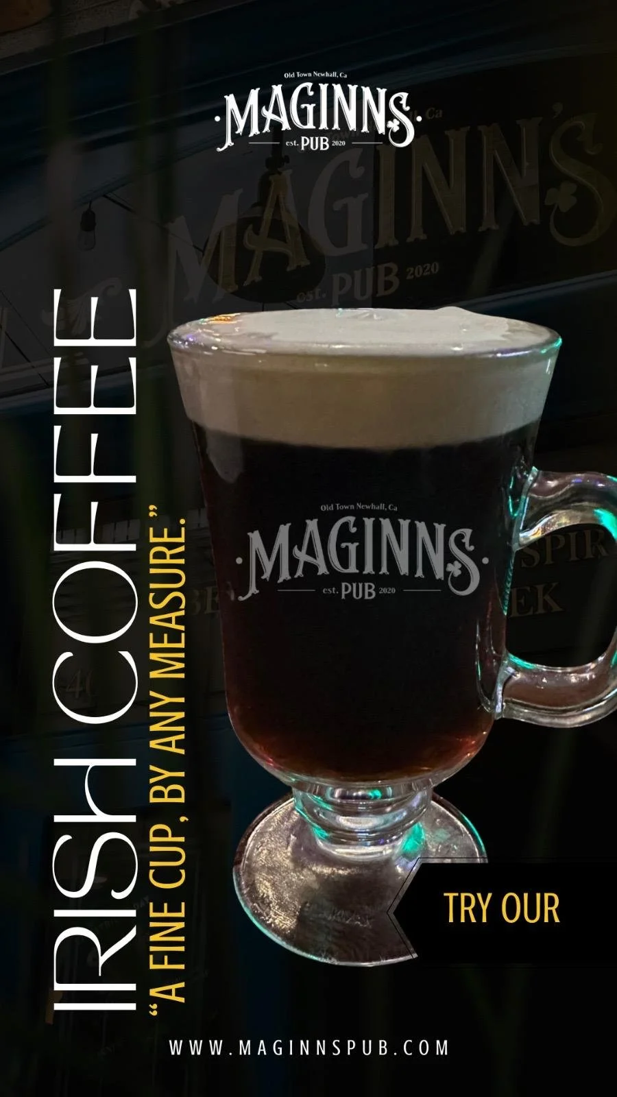 A glass mug with the Maginns Pub logo filled with dark beer and a foam head, sitting on a surface in front of a window.