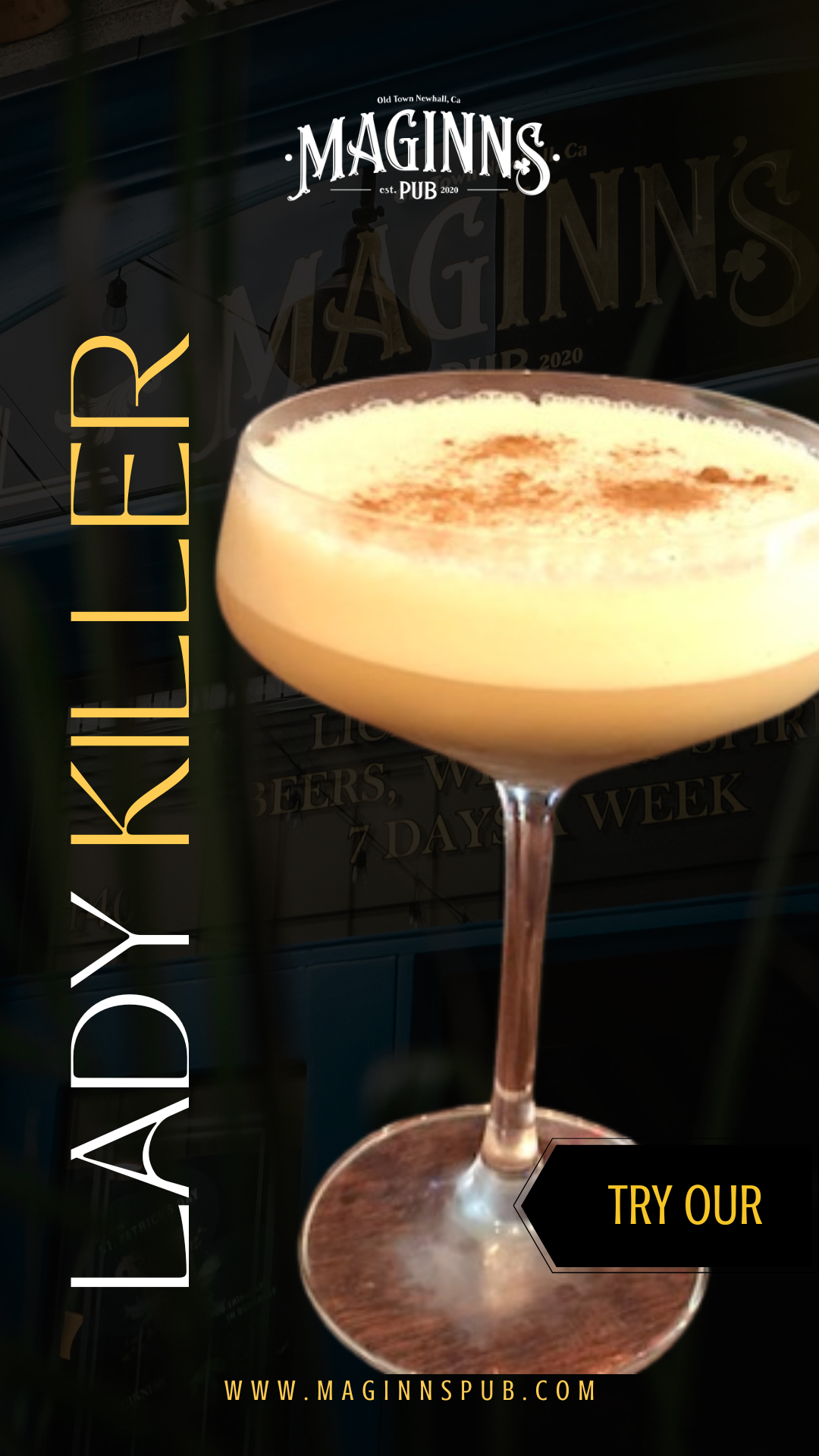 A cocktail in a coupe glass topped with foam and sprinkled with cinnamon or nutmeg, set against a dark background with pub signage.