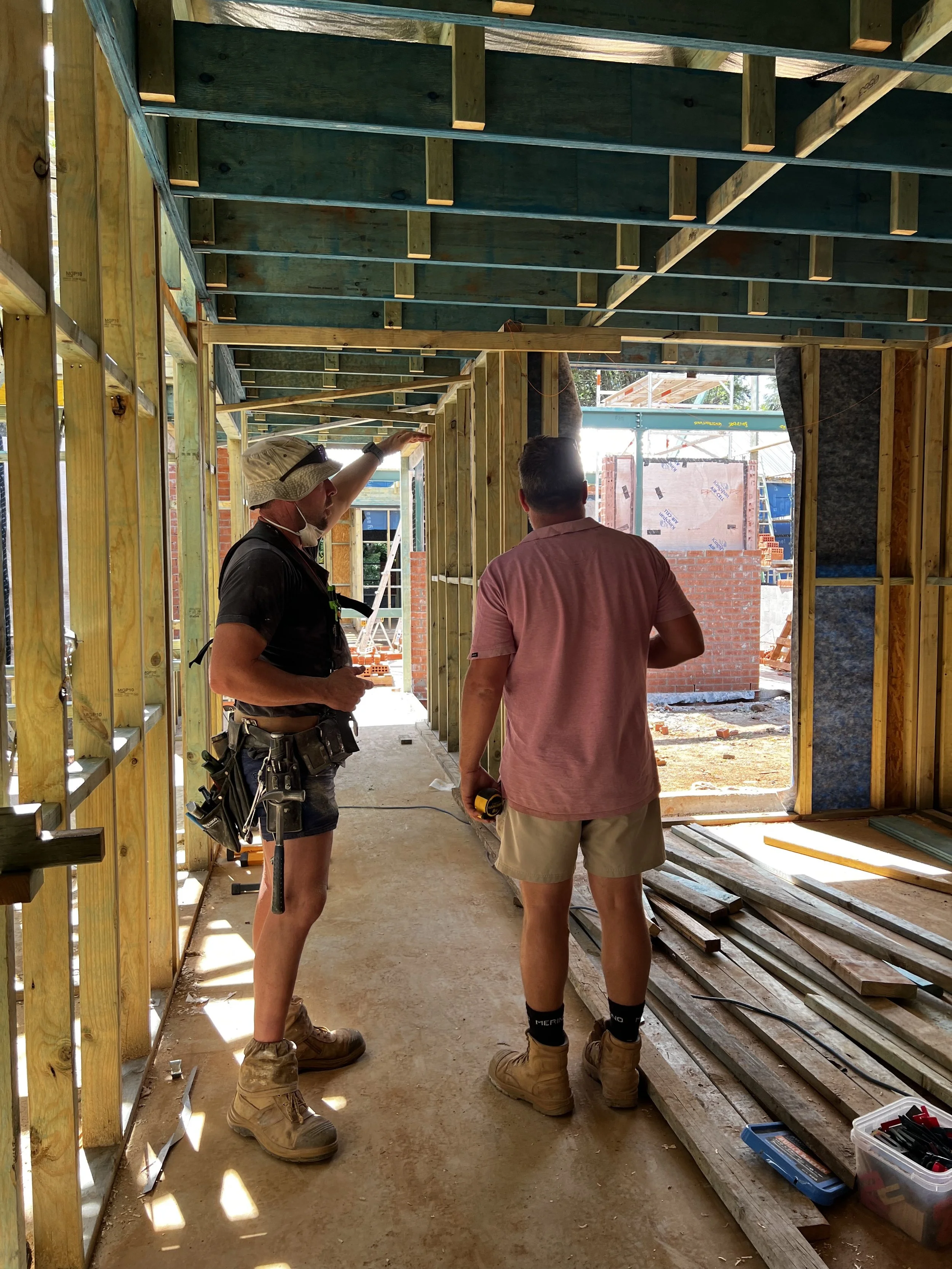 Builder on site reviewing construction details in a Southern Highlands home by Baltimore Constructions