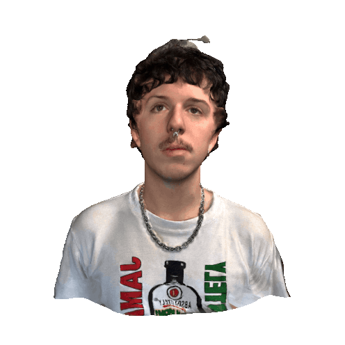 Young man with curly hair, mustache, wearing a silver chain and a white T-shirt with colorful text and a graphic of a bottle.