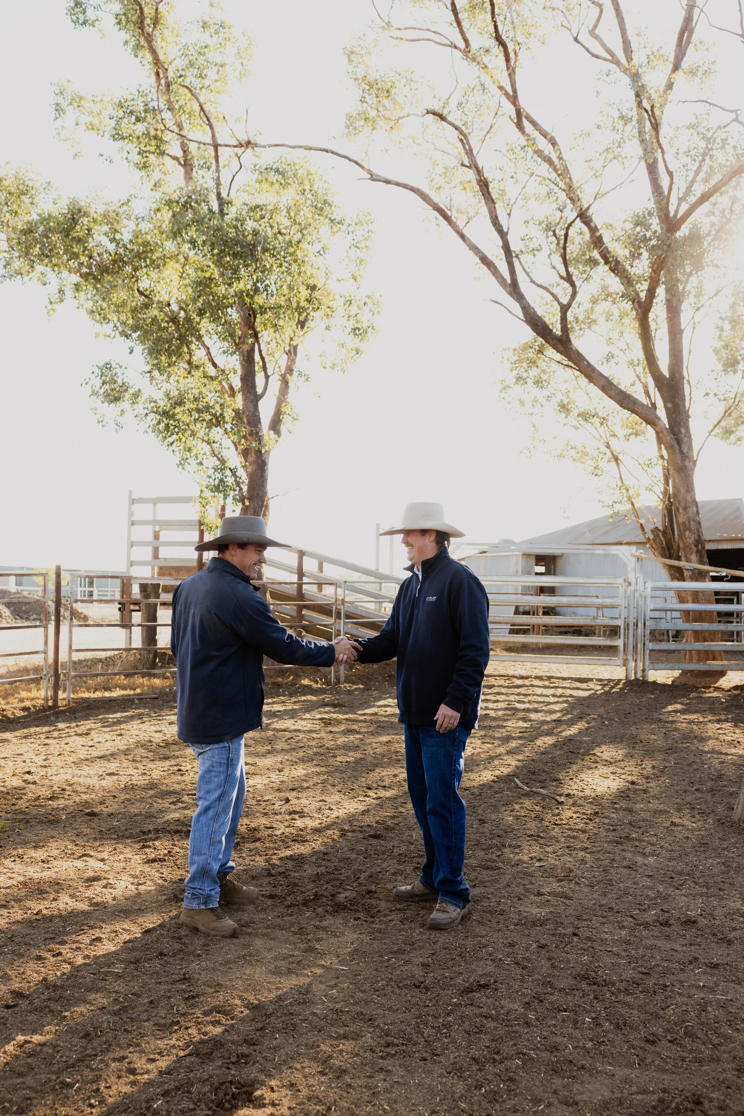 Jim Blain and Jeremy Cummins in a feedlot in regional NSW.