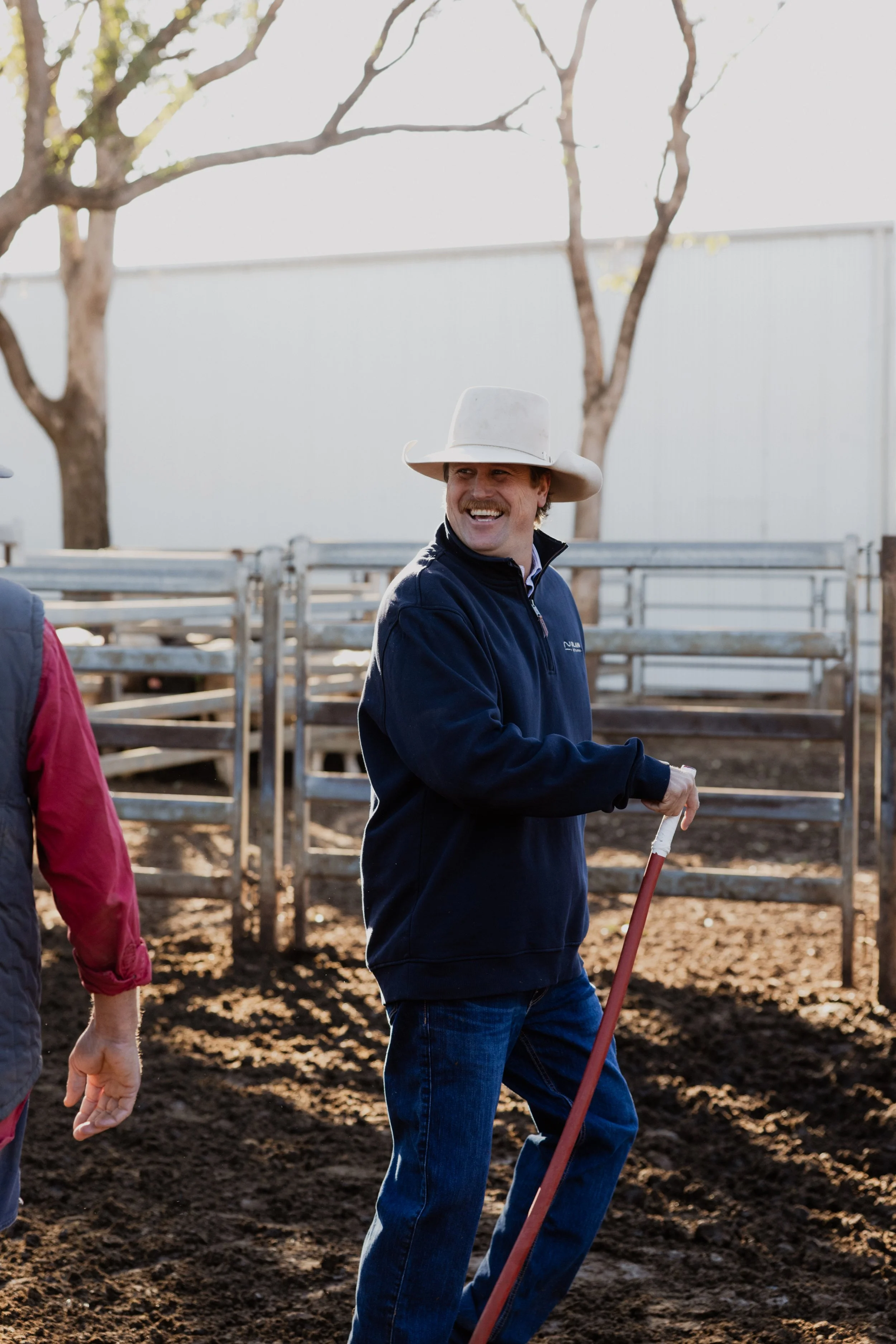 Jim Blain smiling on a cattle farm in regional NSW.