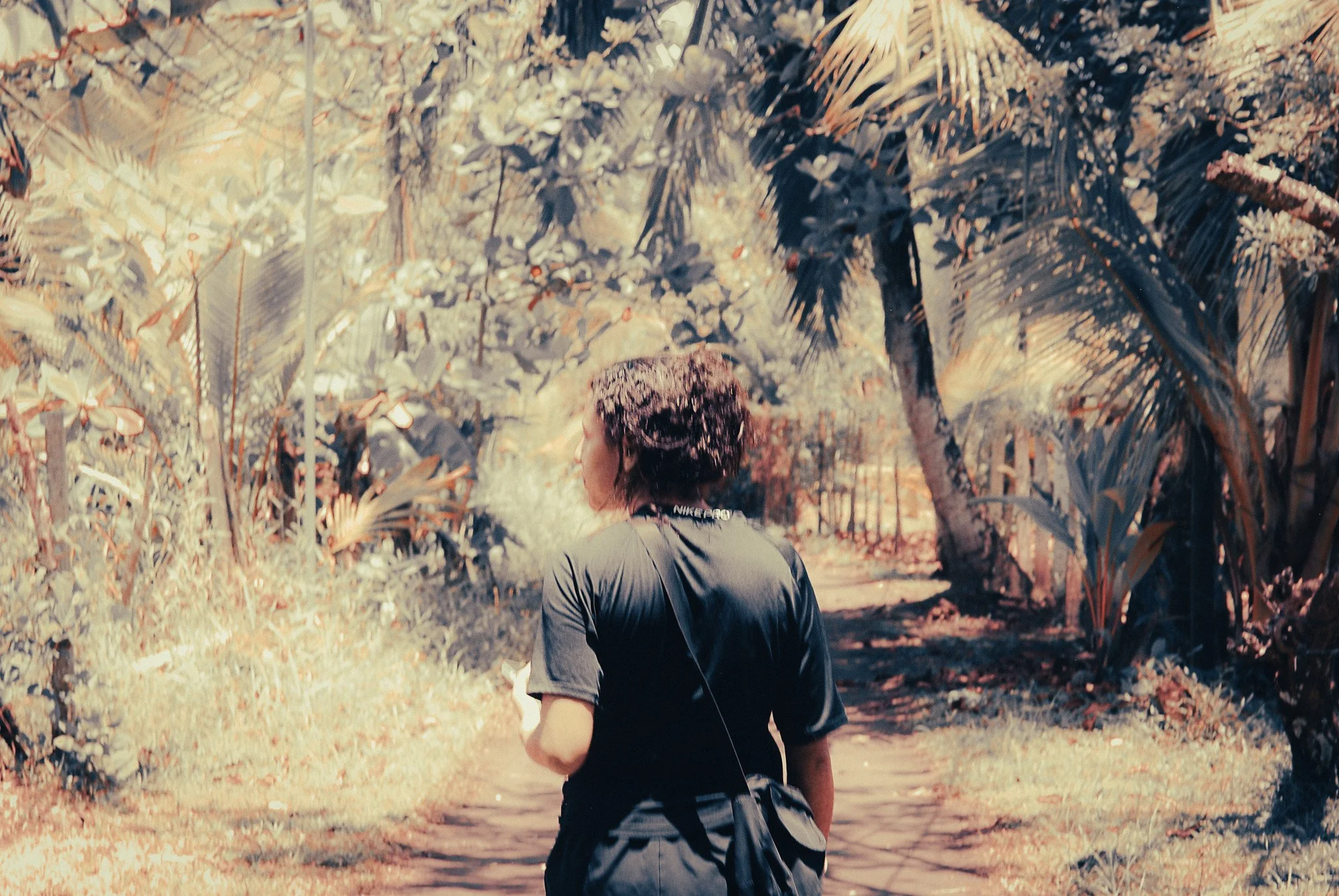 Volunteer walking through the tropical village of Parismina during a sea turtle conservation stay in Costa Rica.