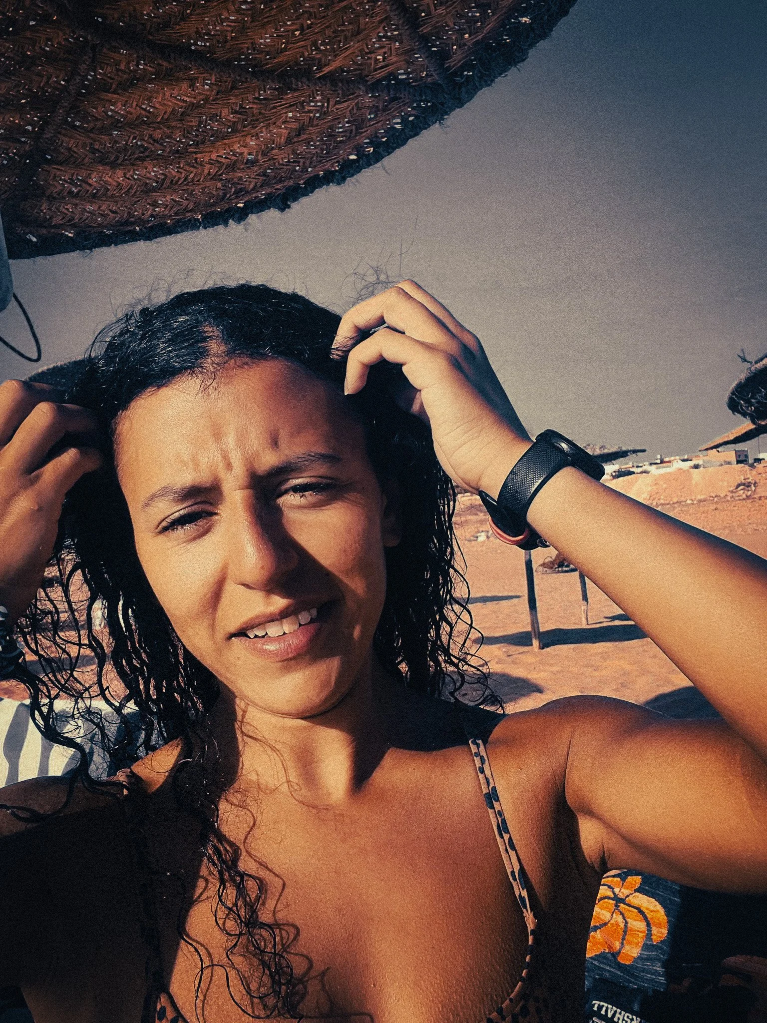 Close-up childhood photo of a girl by the beach in Tangier Morocco on a sunny day.