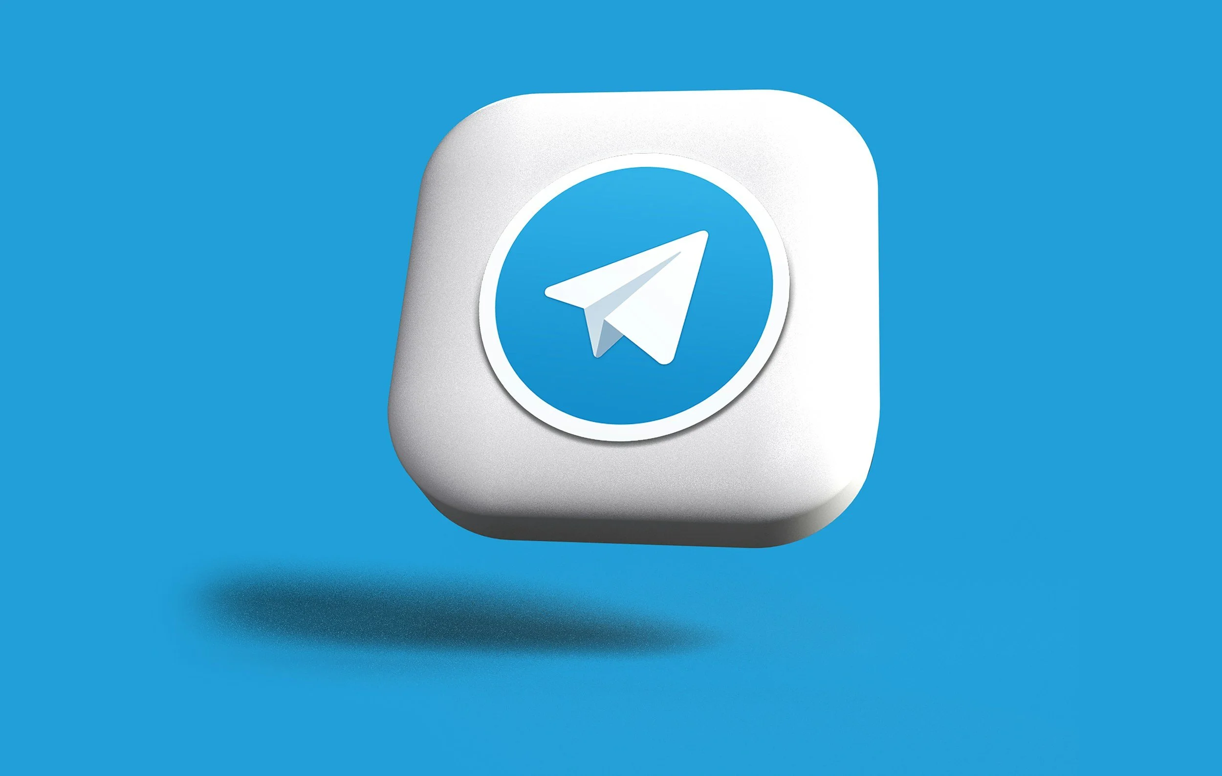 The image features a 3D icon of the Telegram app logo, which is a paper airplane inside a blue circle, on a white rounded-square background against a blue backdrop.
