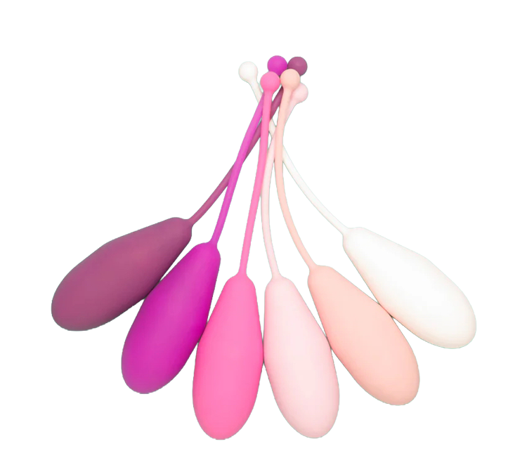 Multiple menstrual cups in various shades of pink, purple, and white, arranged in a fan-like display on a black background.