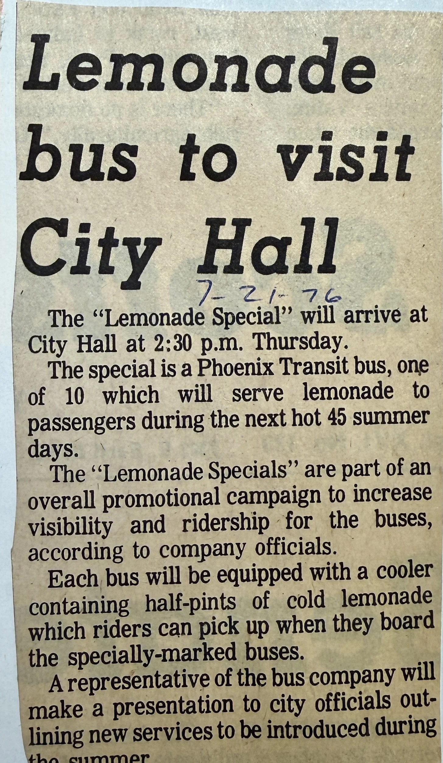 A printed newspaper clipping about a Lemonade Special bus visit to City Hall scheduled for 2:30 p.m. on Thursday, featuring a Phoenix Transit bus serving lemonade to passengers with cold half-pints, and a promotional campaign to increase bus ridership.