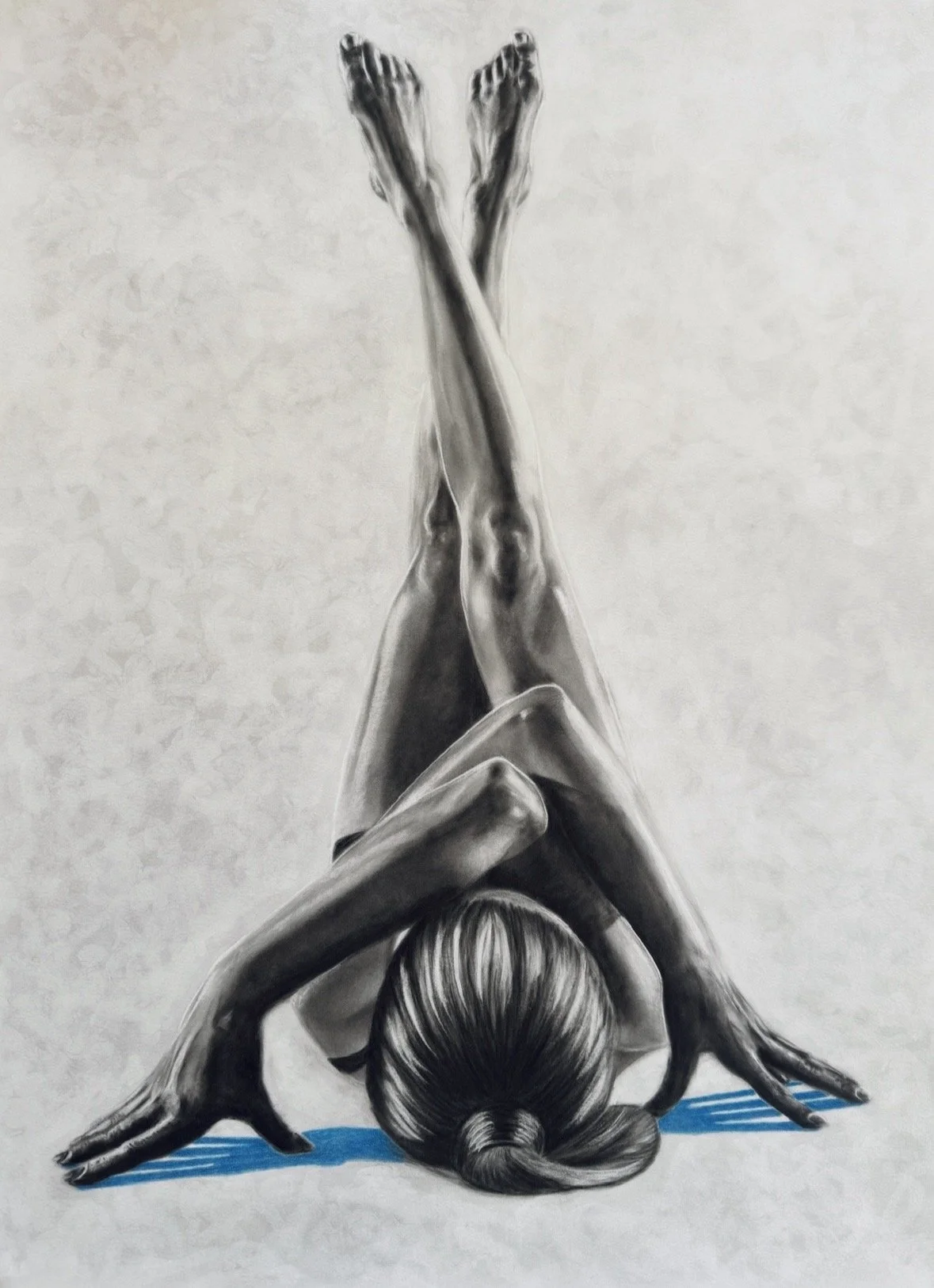 Lifelike drawing of a woman with her head on the ground and her arms extended to opposite sides, fingers touching ground. She has  hair tied back and is wearing a black leotard. The background is neutral, with a small blue shadow beneath her hands.