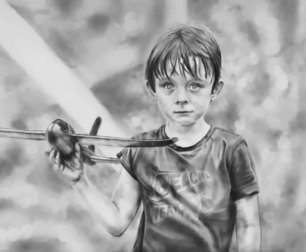 A black and white realistic drawing of a young boy holding a toy aeroplane. He is looking directly at the viewer with a serious expression, and his hair is slightly messy. The background is abstract with blurred shapes.