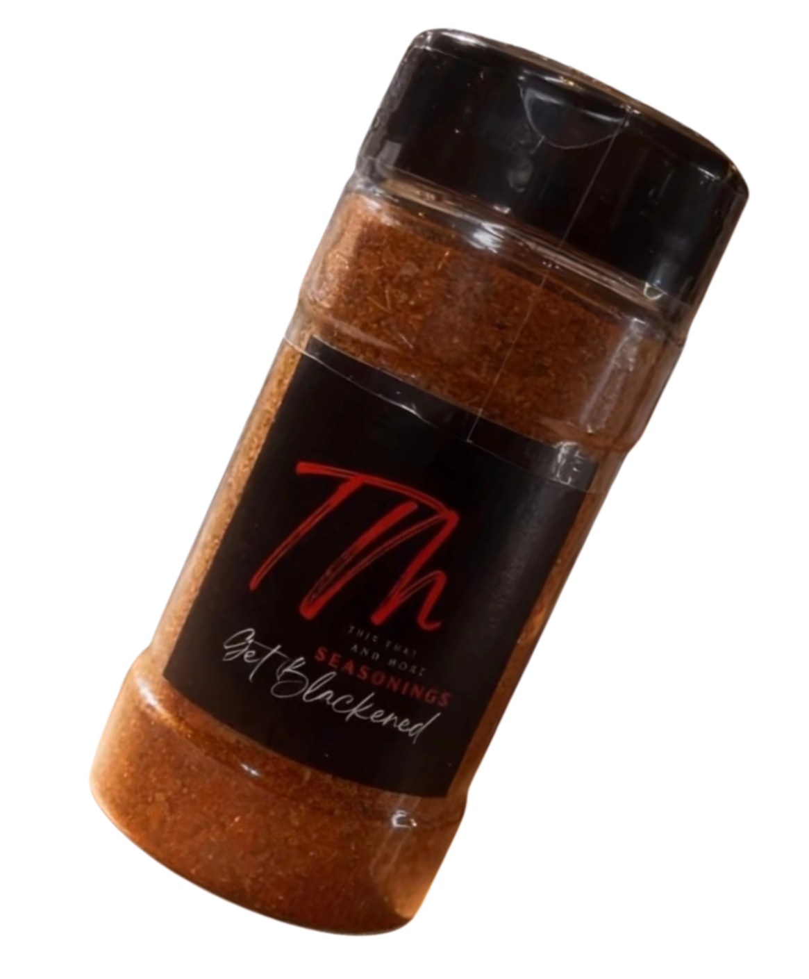 A plastic container of seasoning labeled 'Th' with the text 'Thick, Rich and No. 1 seasons' and 'Get Blackened' in white cursive, with a black and red label.
