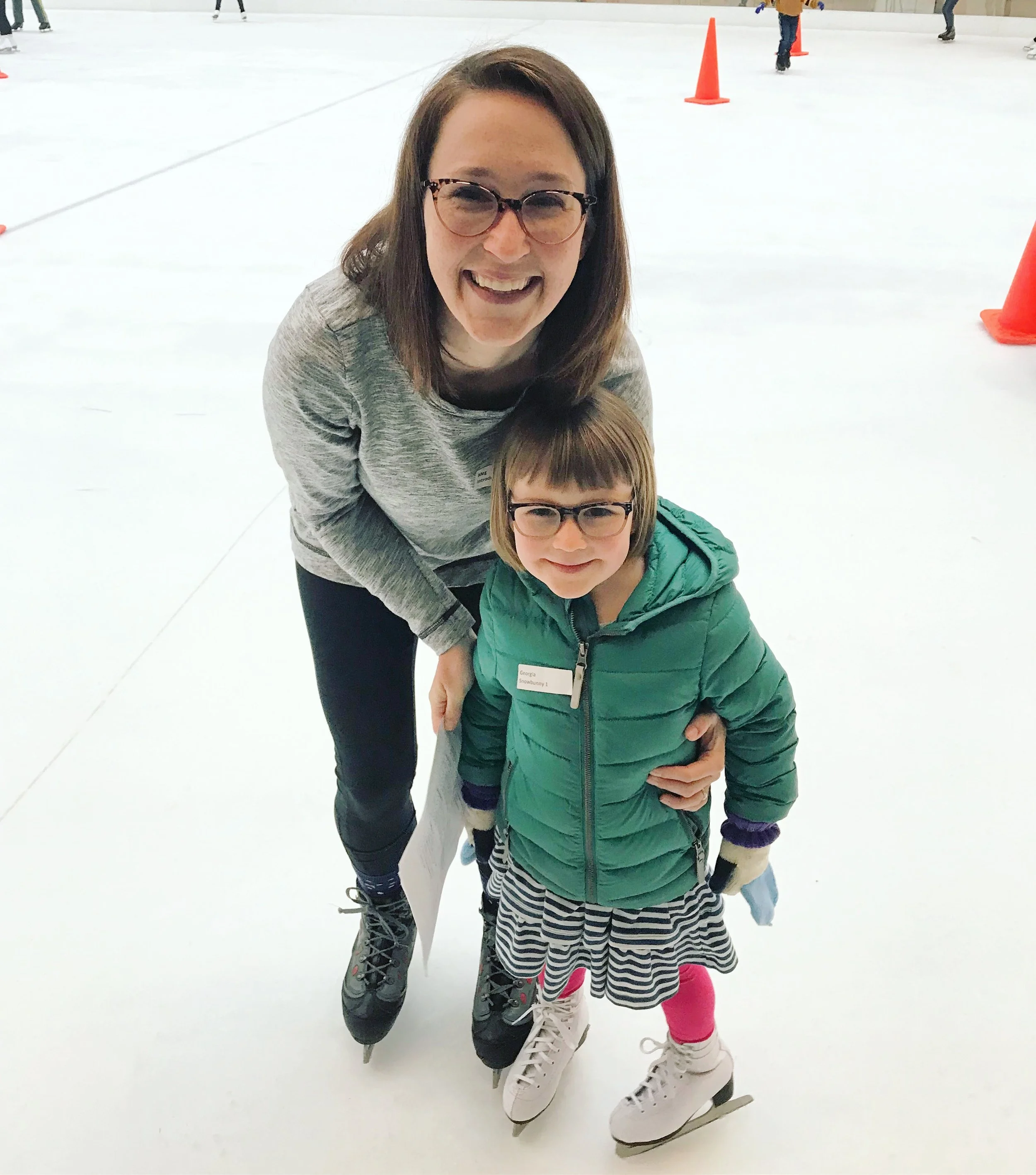  Georgia Krugel and her mother, Meg Krugel, take the ice together in their Introductory class with Coach Emily Wong.  Photo courtesy of Meg Krugel.  