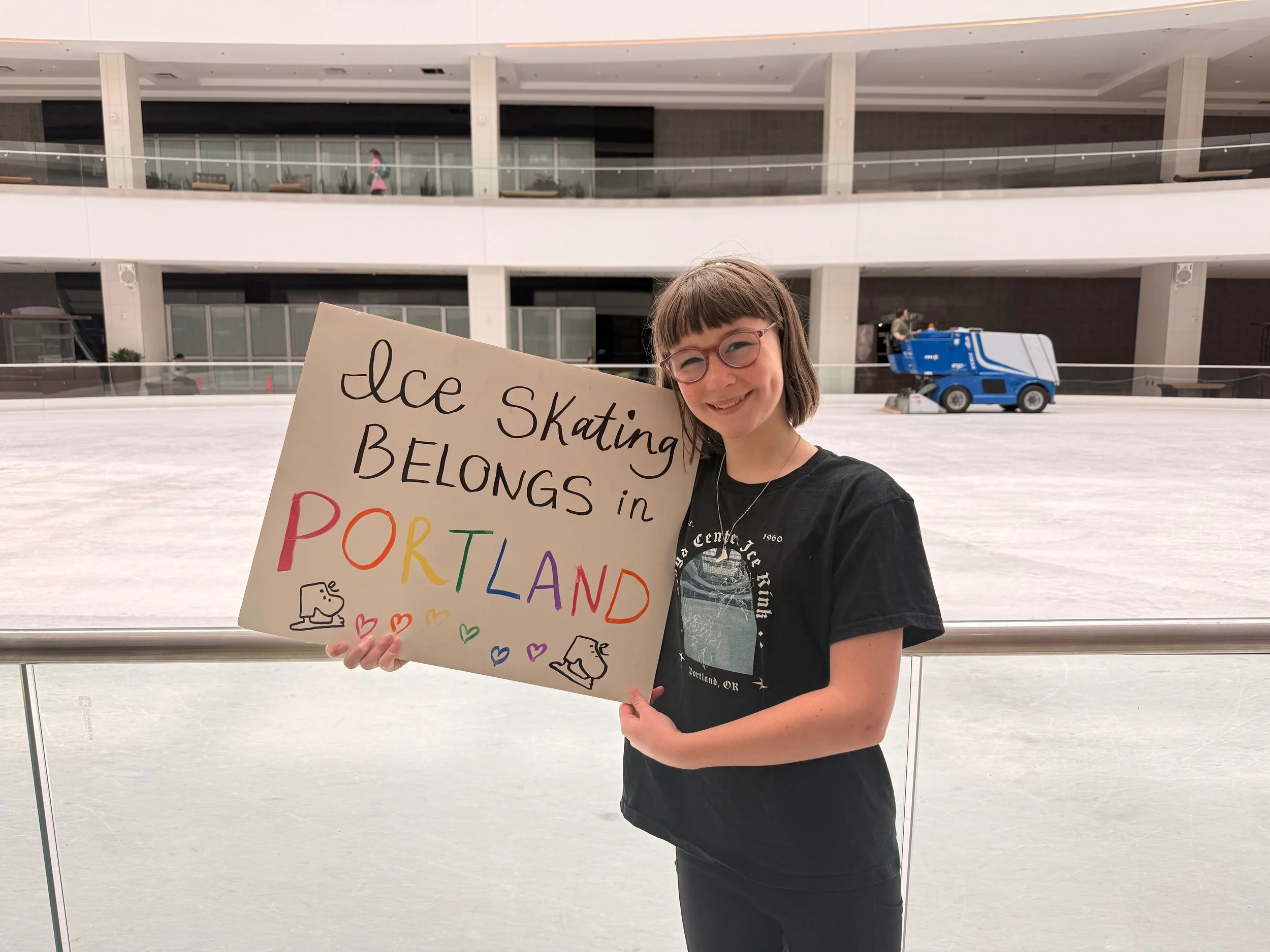  Georgia holds a sign she made for the Portland Pride Parade when BISC was invited to march with the Rose City Rollers.  Photo courtesy of Meg Krugel.  