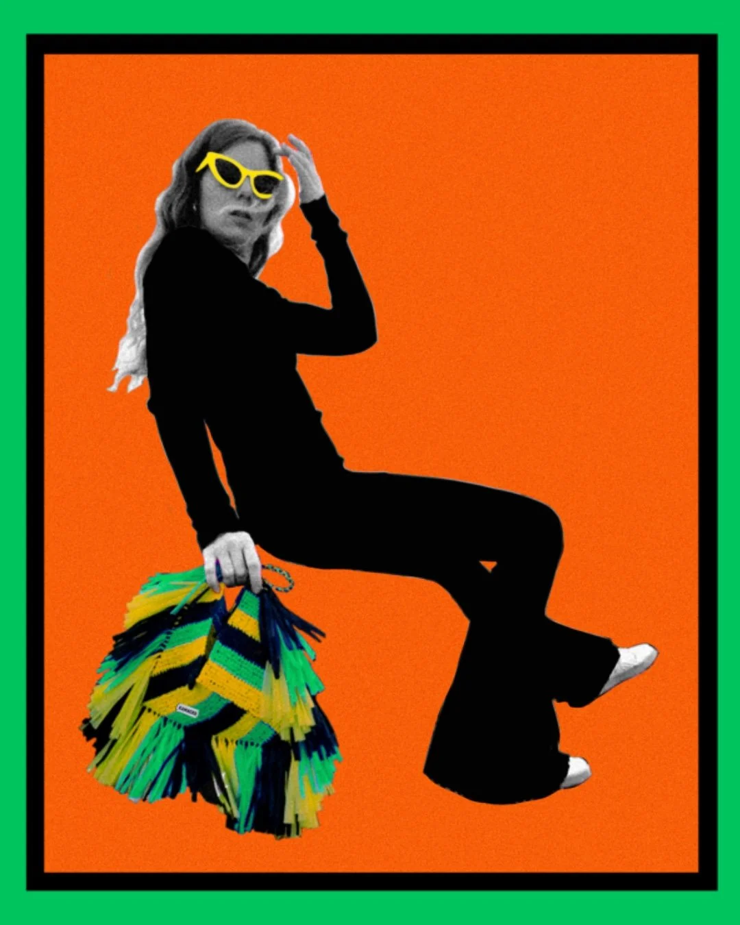 A woman sat with yellow sunglasses, holding Kamacko crochet bag Le Deià, handmade in raffia by Malagasy women, with graphic green, yellow and black stripes with fringes. Orange back ground.