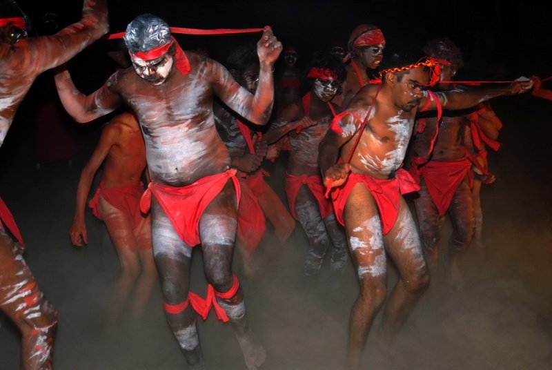 Painted dancers in red