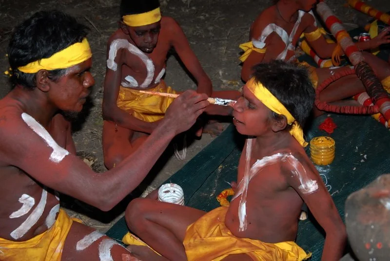 Dancer in yellow being painted