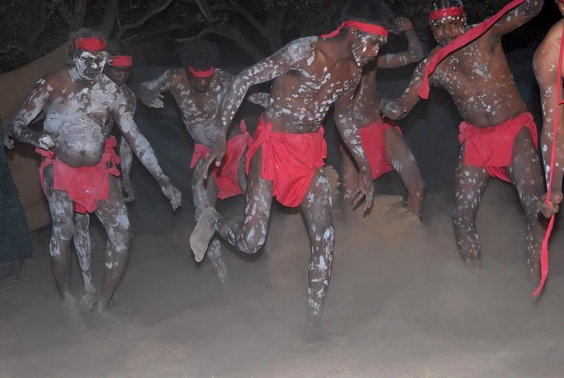 Men in red dancing 