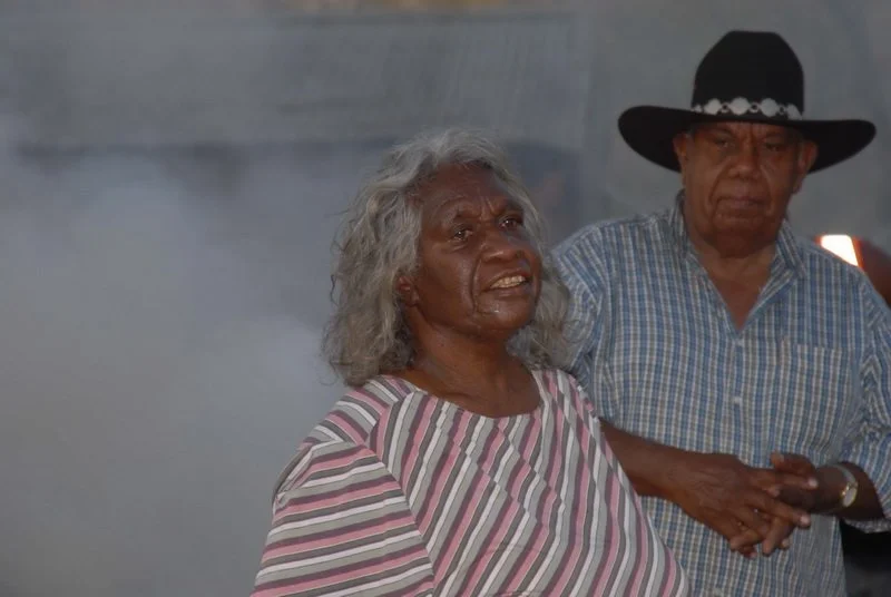 Woman in front of smoke
