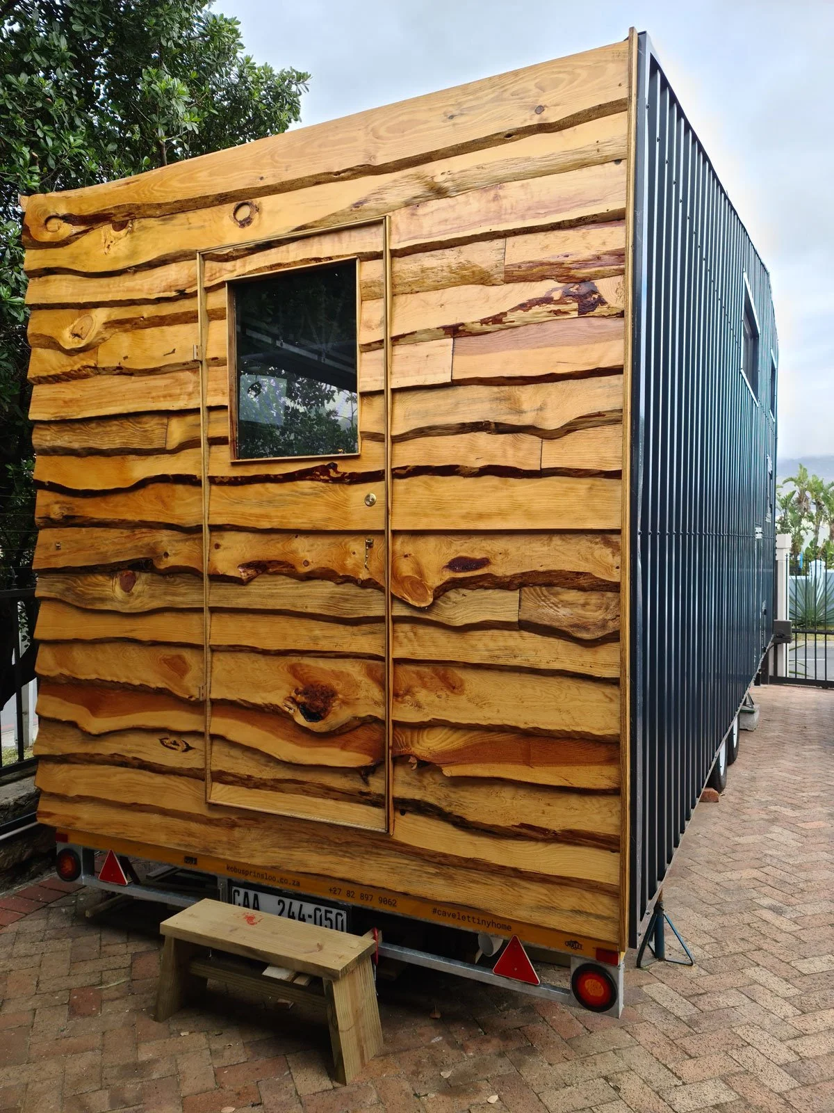 Locally sourced pine creates a beautiful live edge lap-board finish while the rear of the CaveLet tiny house is cladded in coloured IBR sheets.