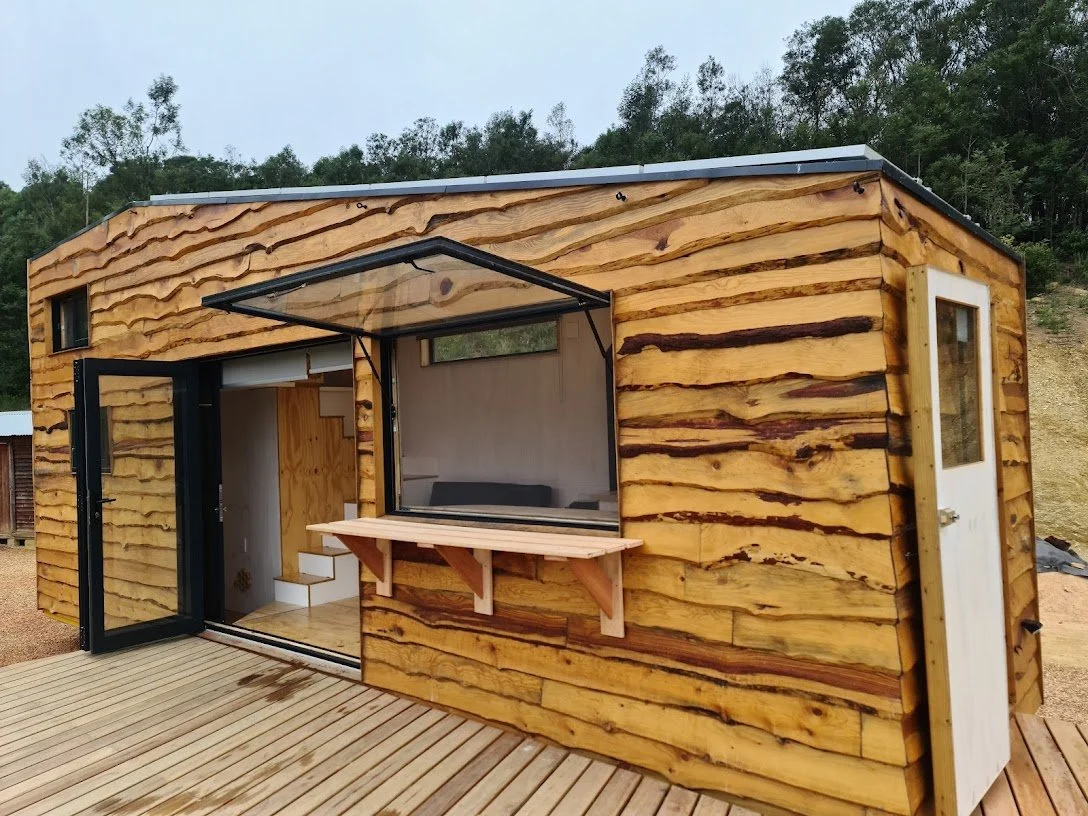 The 50 square meter deck adds tons of living space to the tiny house, complete with dimmable outdoor light and wood store. 

A 5kw inverter with lithium batteries, charged by the solar covered roof of the CaveLet keeps the lights on.

The 1 kilo lite