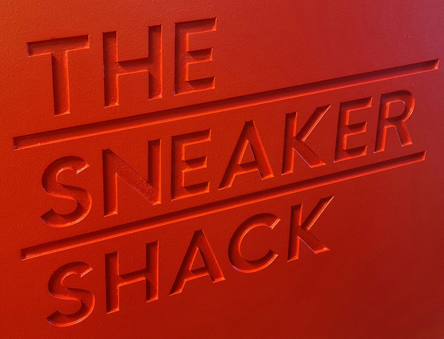 Slick CNC'd signage meets rustic plywood and striking black steelwork to create this vibrant retail space.