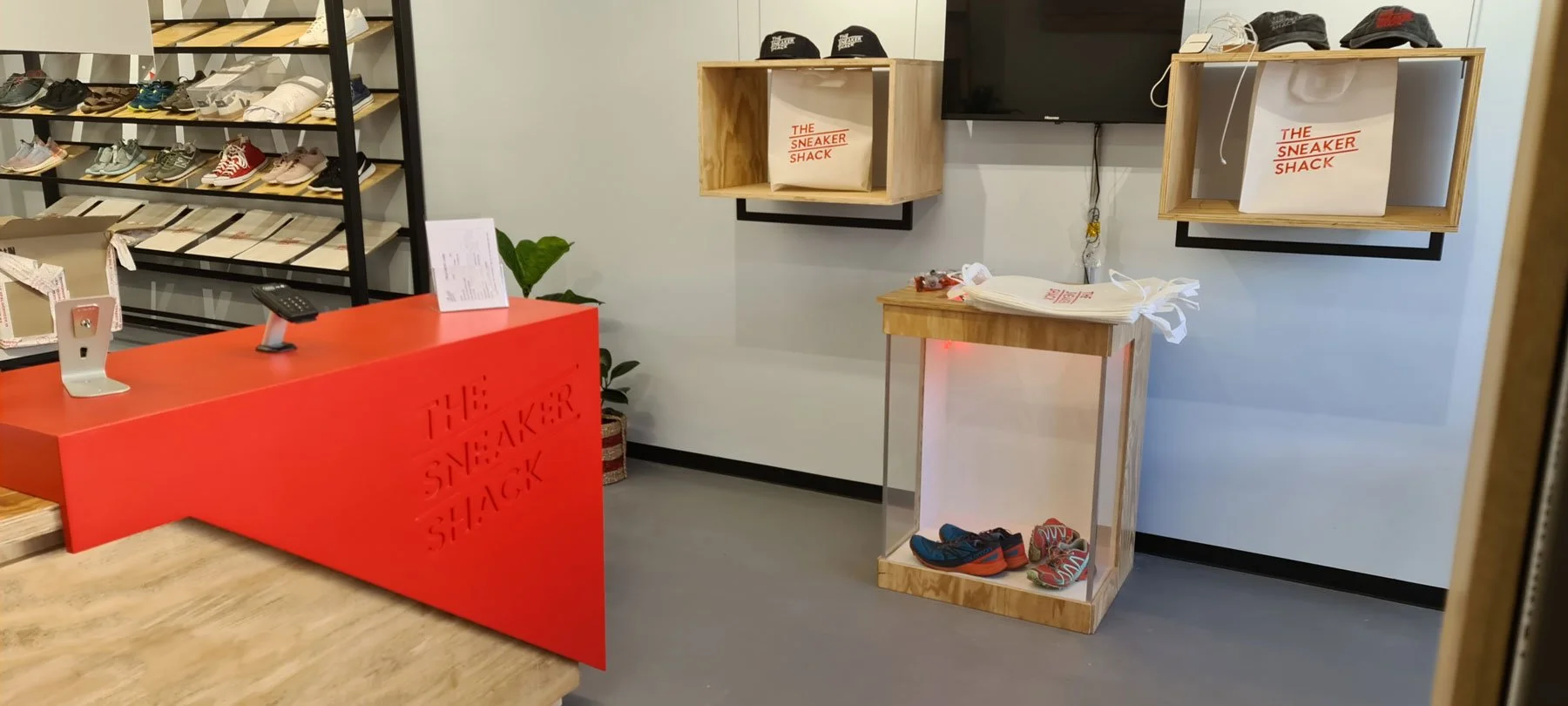 Slick CNC'd signage meets rustic plywood and striking black steelwork to create this vibrant retail space.