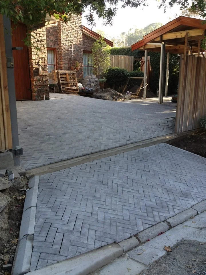 Herringbone paving. A roof to match the existing home