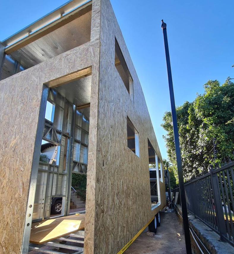 Light steel frame construction is used to keep the tiny house weight to a minimum on the professionally built double axle trailer.