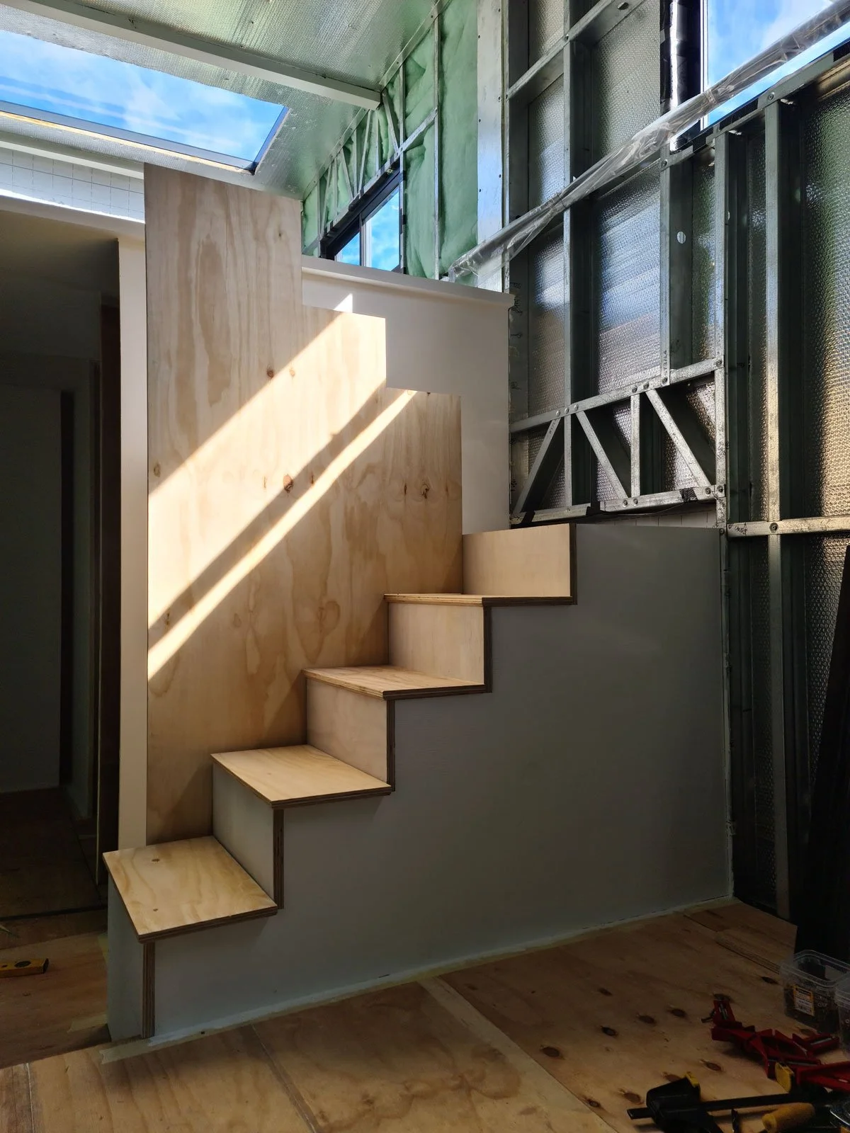 Pine plywood used throughout the tiny house, in various thicknesses to fashion the floors, mezzanine and staircase..