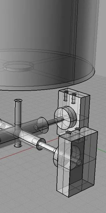 A 3D CAD model showing mechanical components, including shafts, supports, and brackets, in a digital design environment.