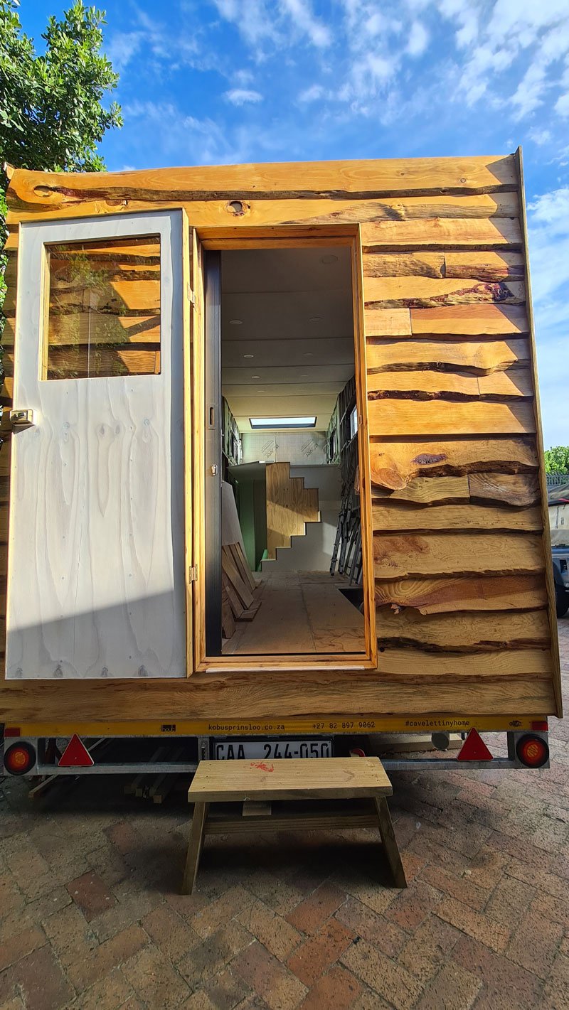 Locally sourced pine creates a beautiful live edge lap-board finish while the rear of the CaveLet tiny house is cladded in coloured IBR sheets.
