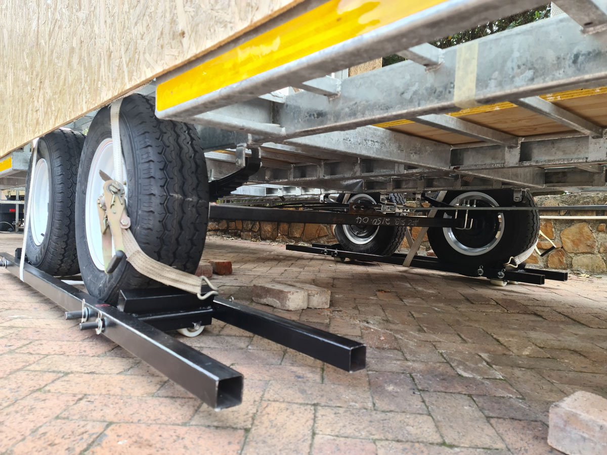 Light steel frame construction is used to keep the tiny house weight to a minimum on the professionally built double axle trailer.