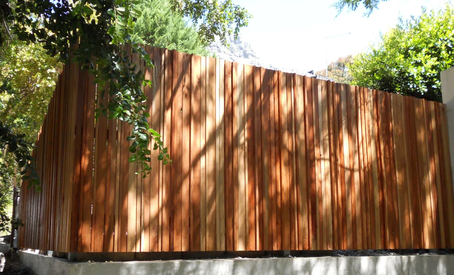Red gum timber cut to various sizes and arranged to create this effect. Inside – solid red gum timber beams and galvanized posts, longevity guaranteed.