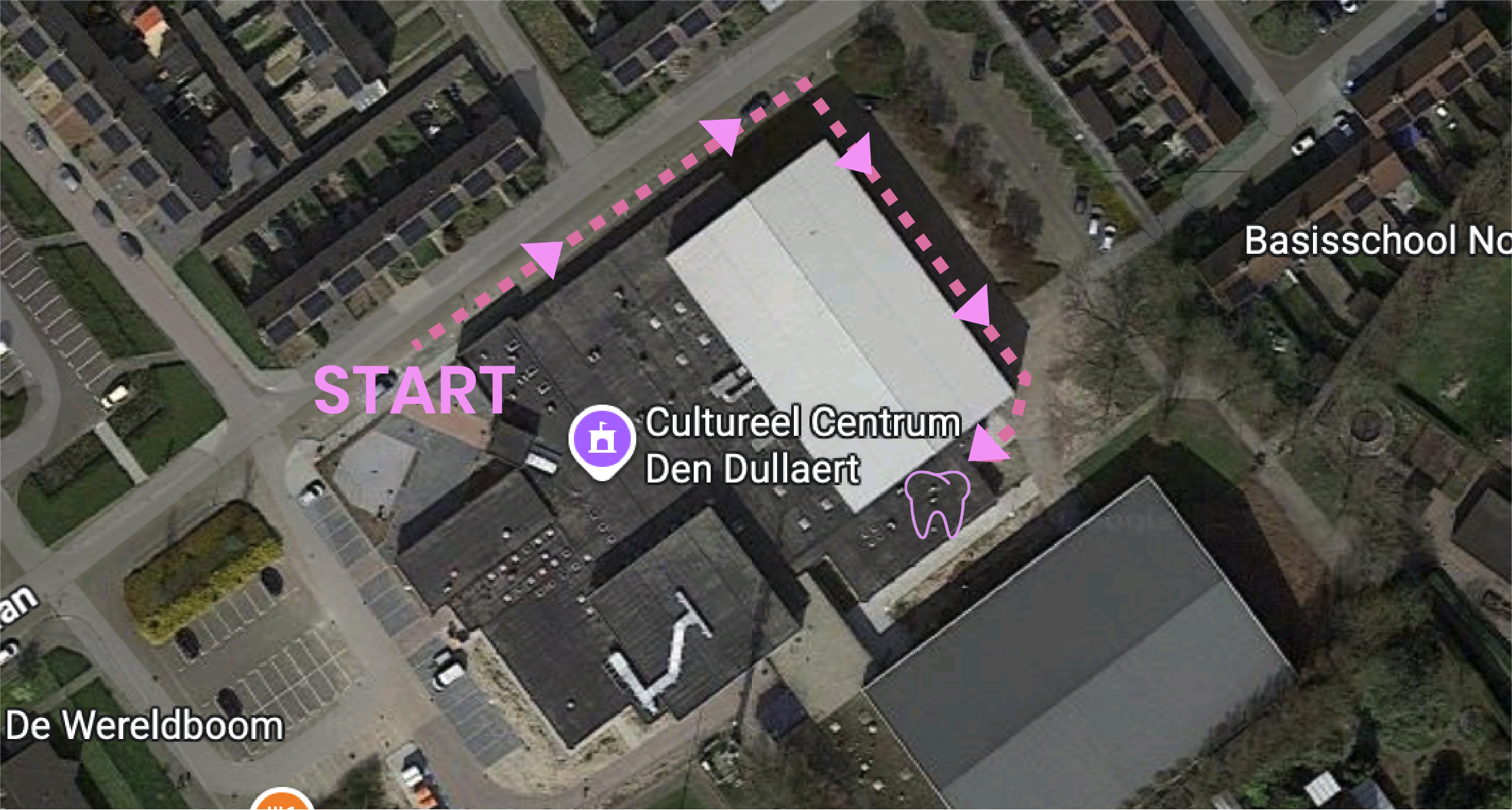 Aerial map showing a walking route around a building labeled 'Cultureel Centrum Den Dullaert,' starting at a pink 'START' point near the building, with pink arrows indicating the route that loops around the building and passes by a tooth icon, with labels 'Basisschool No' and 'De Wereldboom' nearby.