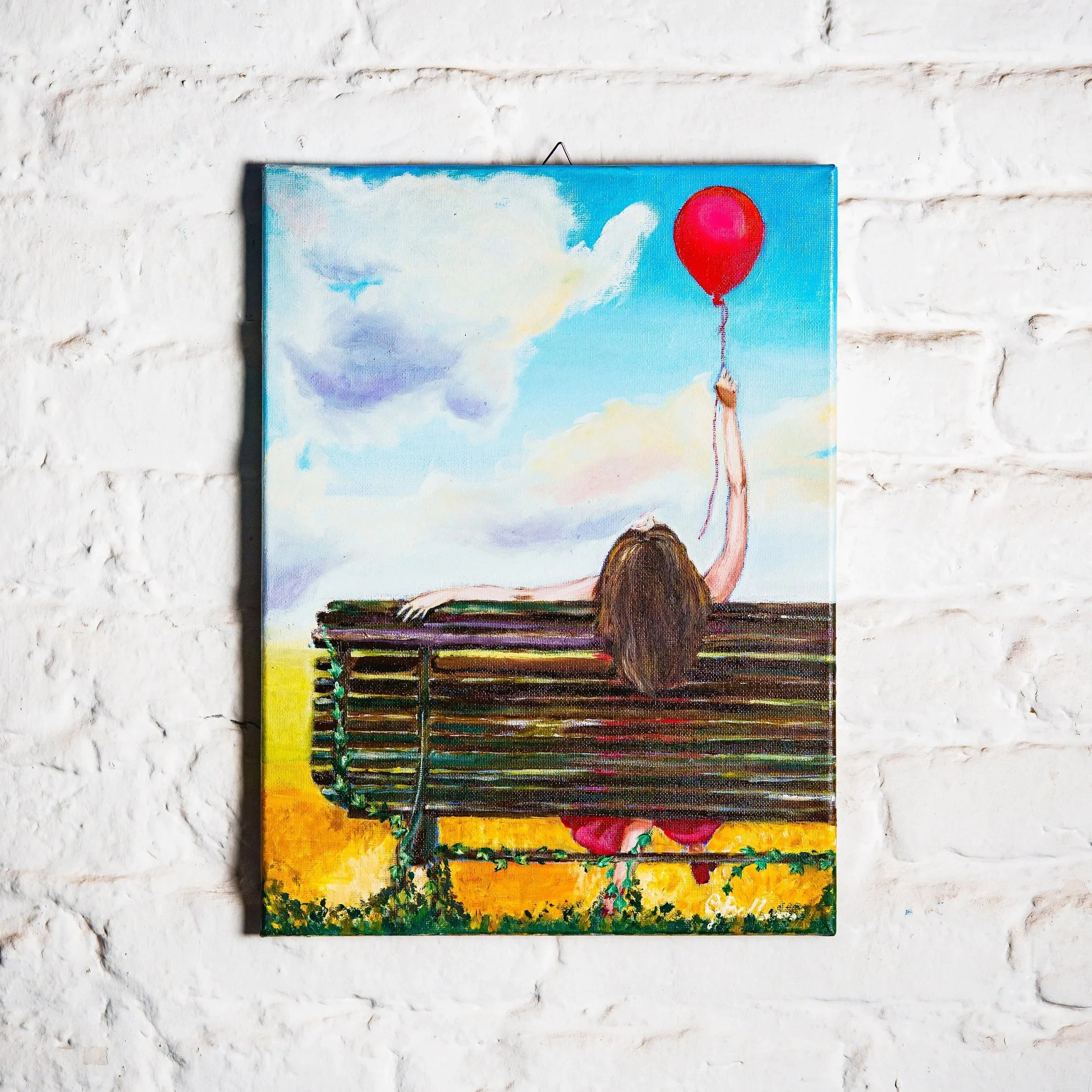 Olio 30x40 donna in rosso, su panca con edera, con palloncino rosso che si alza nel cielo