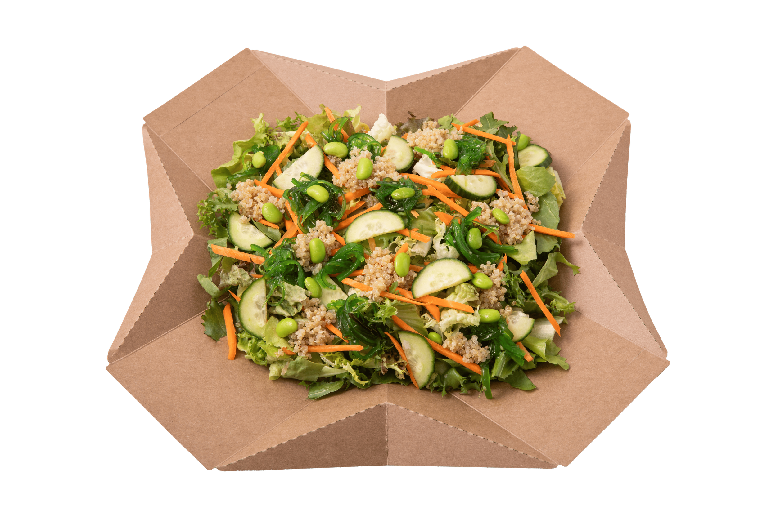 Salad with greens, cucumbers, carrots, edamame, and quinoa in a brown paper container.