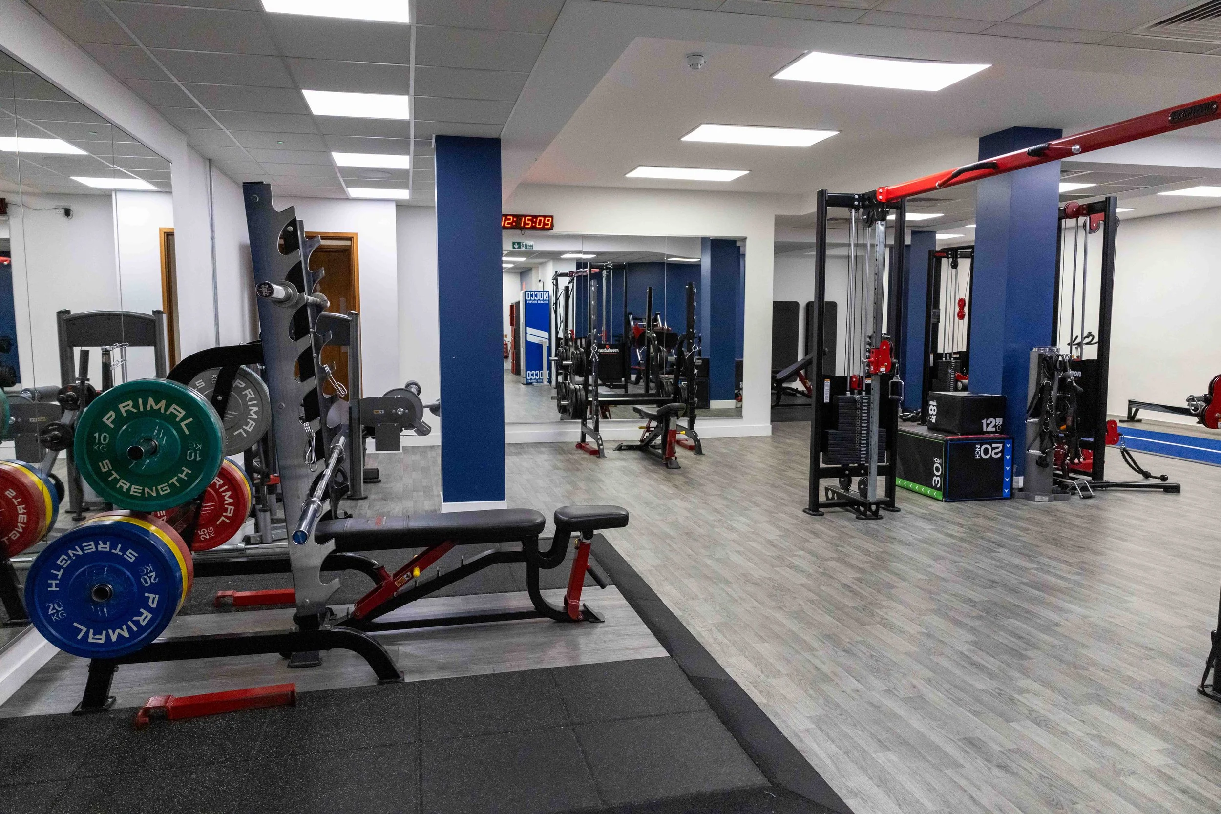 NRG Sports Therapy clinic gym floor in Bloomsbury, Central London, with strength training equipment and rehabilitation space.