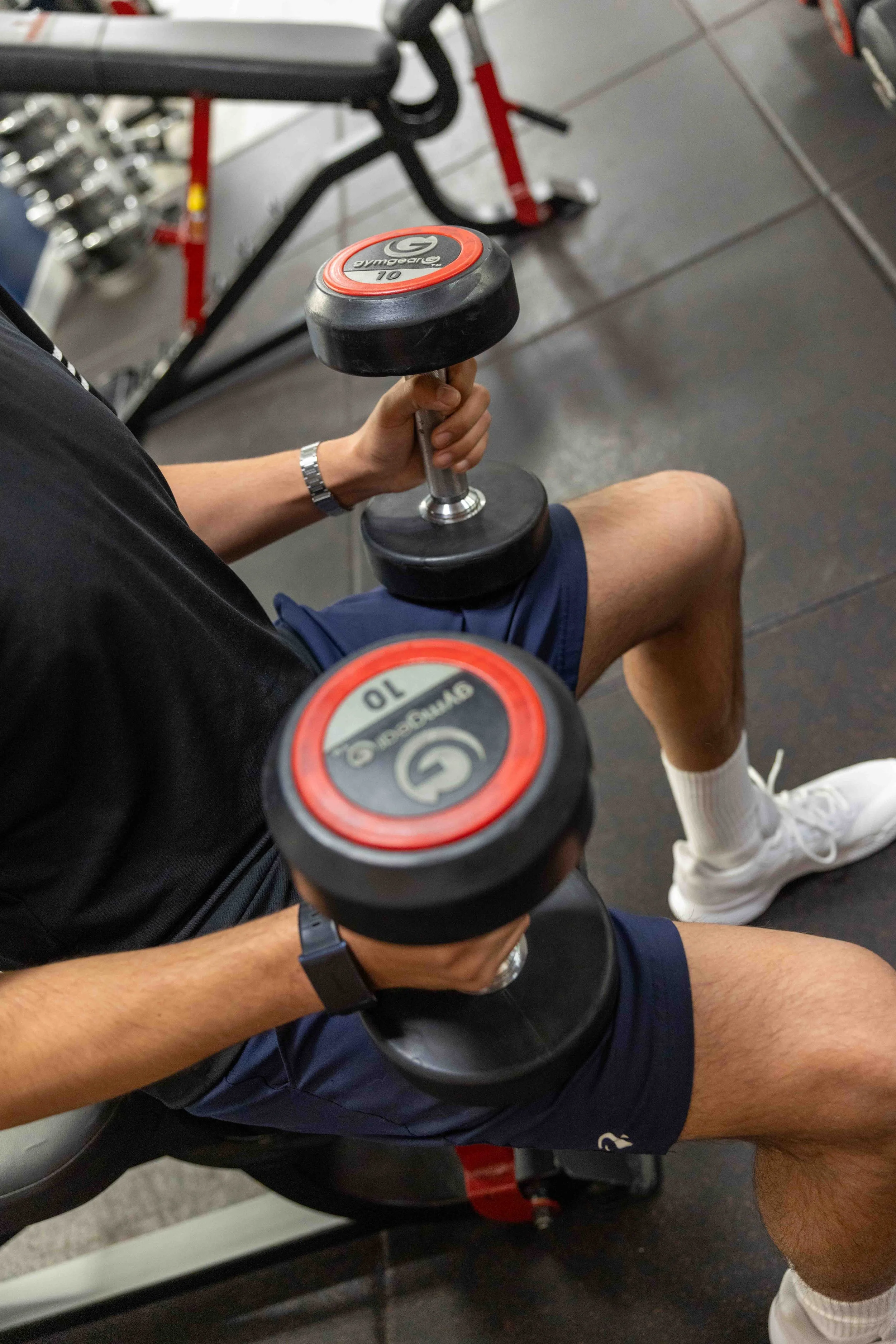 man lifting weights