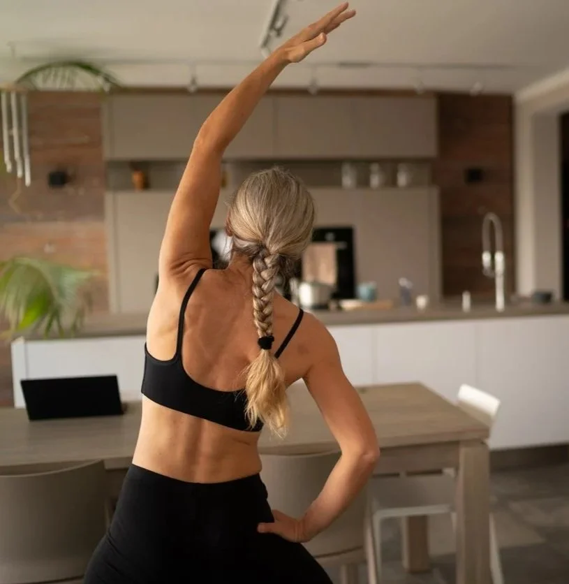 Client doing a prescribed mobility exercise at home — part of a remote rehabilitation programme delivered by NRG Sports Therapy via online consultation.