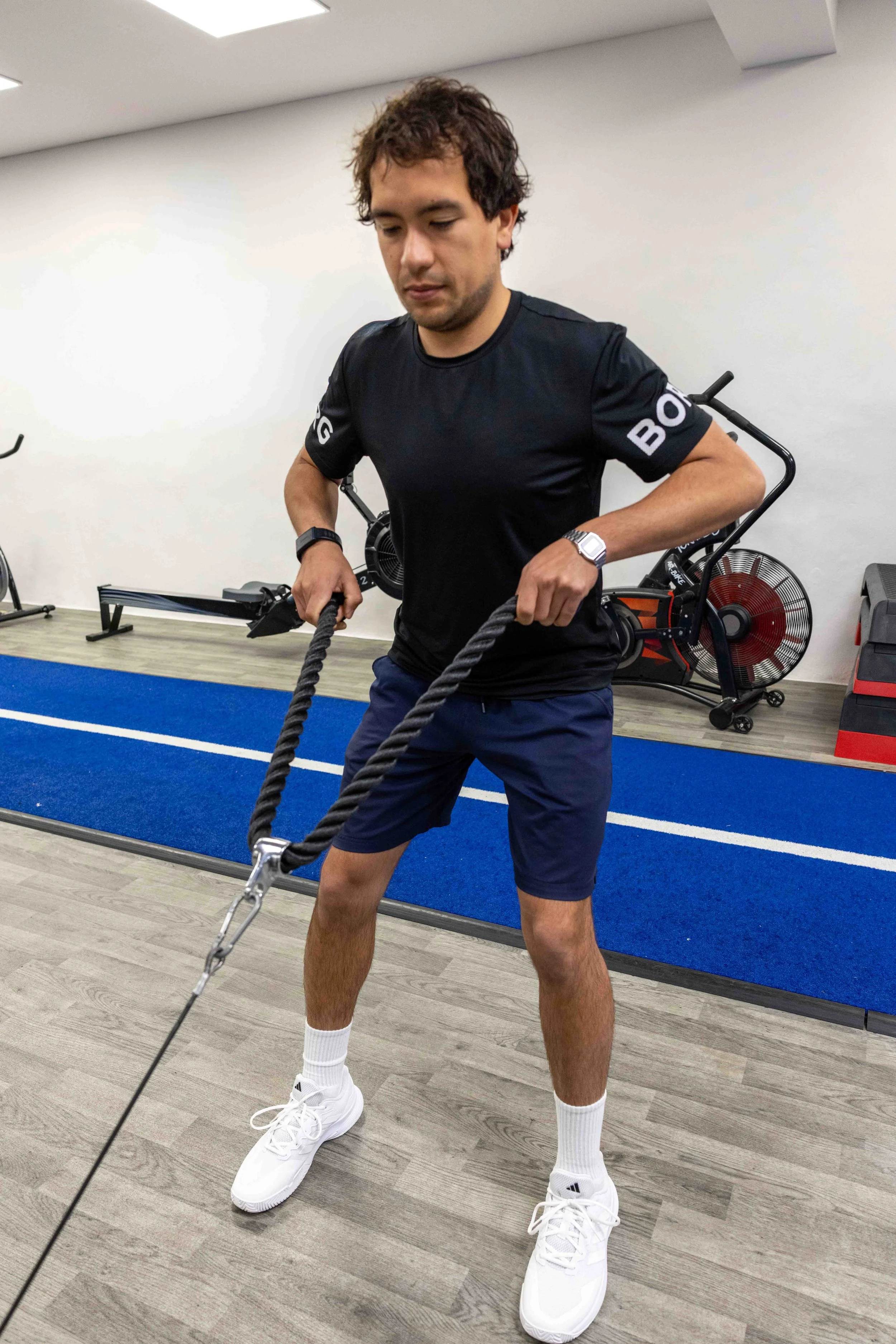 Client performing a cable resistance exercise during a one-to-one personal training session at NRG Sports Therapy in Bloomsbury.