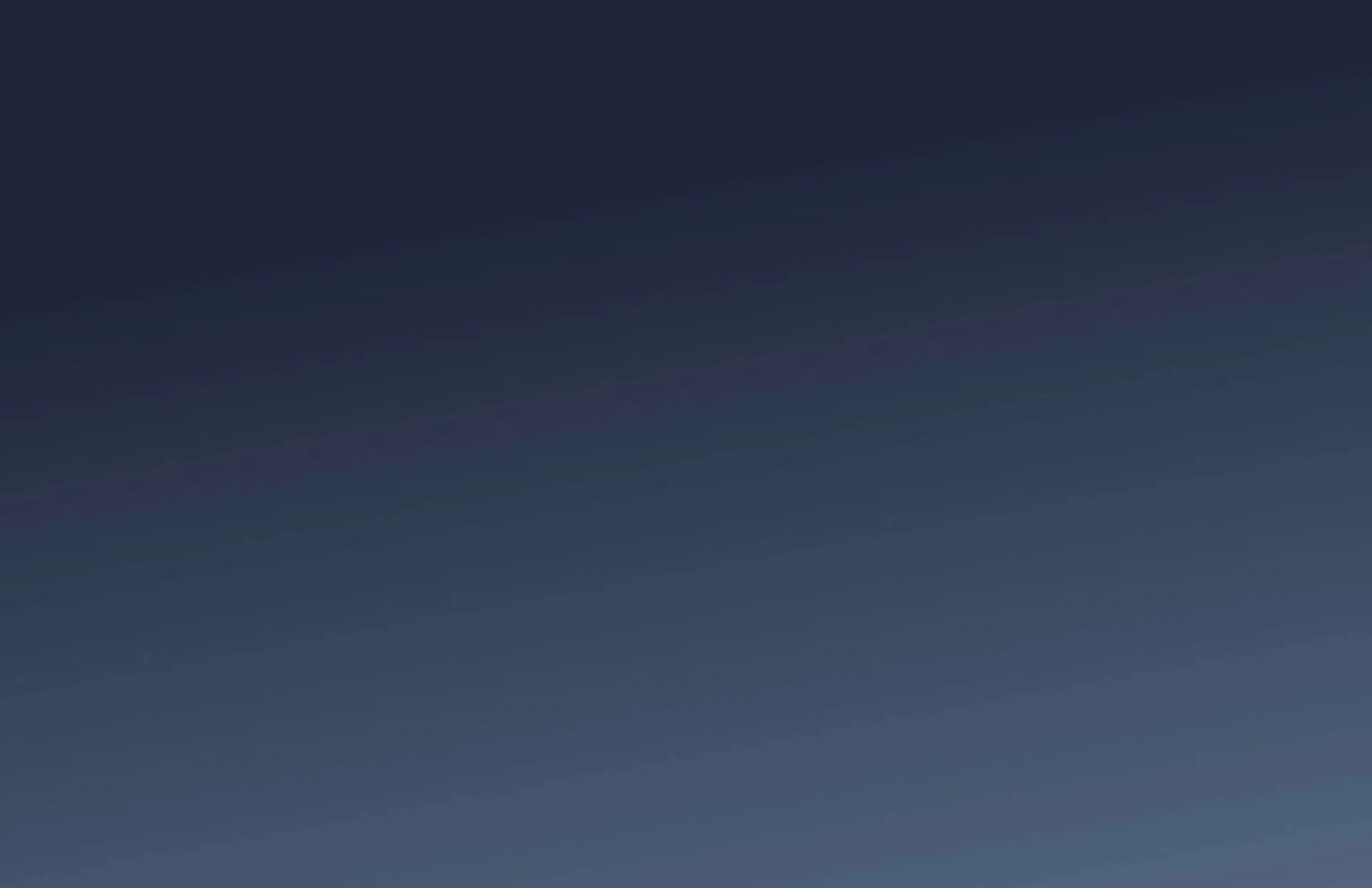 A clear night sky with a faint star visible in the upper right corner.