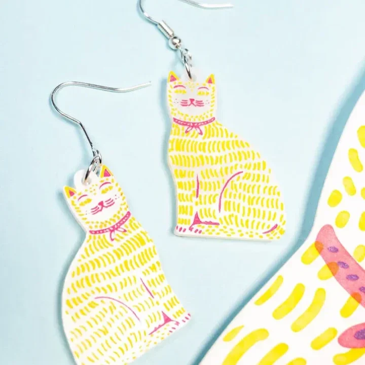 CatWearingARibbonEarrings_c0e8e1d7-0c0f-4c62-a4e5-02d1403afe88.webp