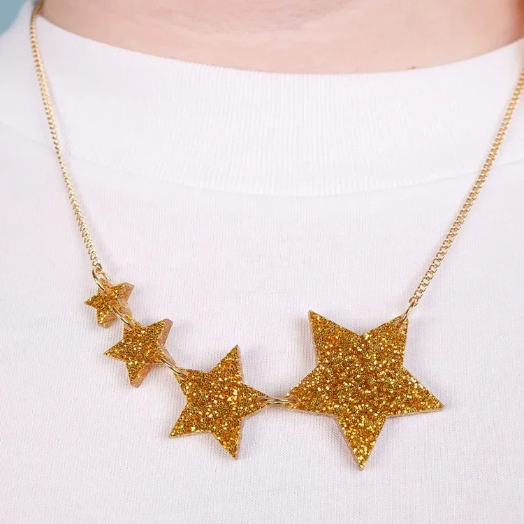 shooting-star-necklace-glitter-gold.webp