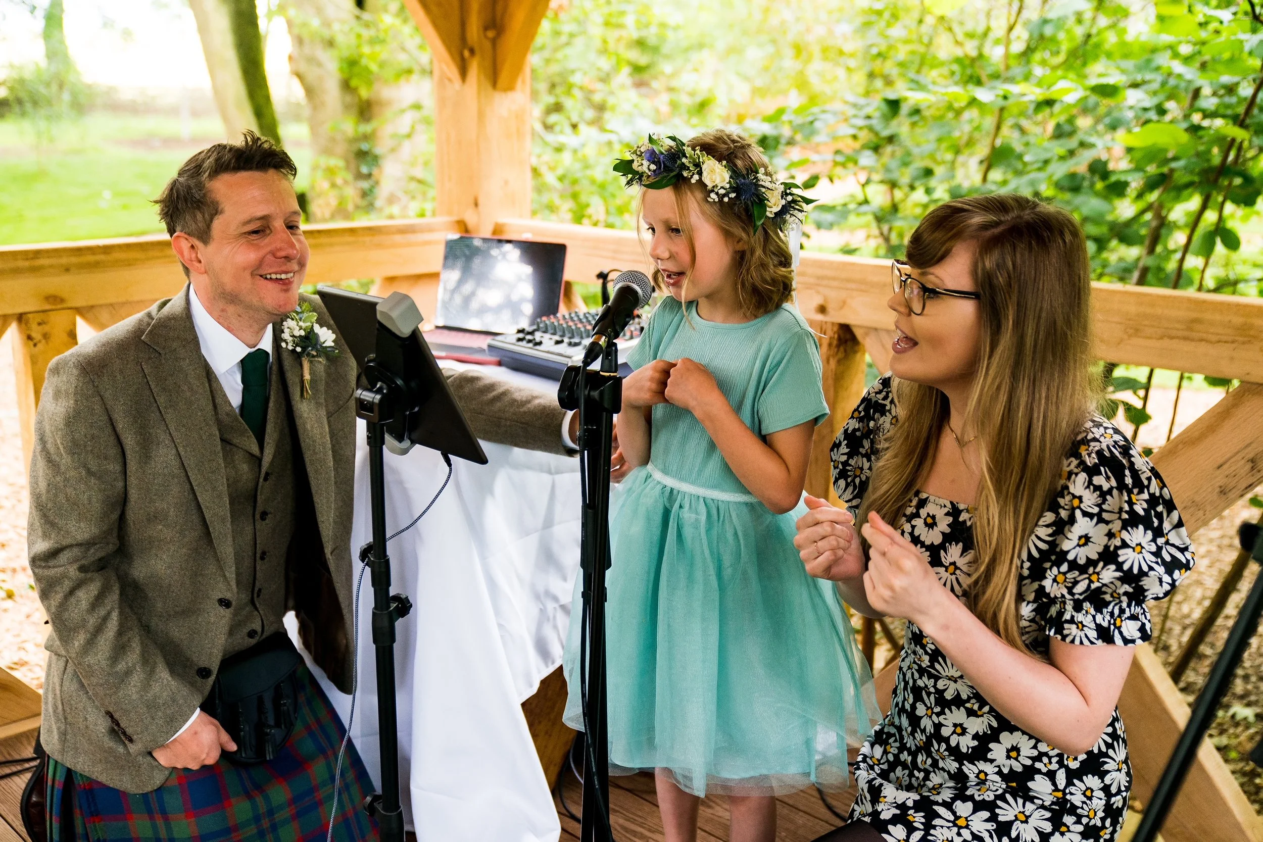 Kay from Sing with Kay helping a young girl build confidence while singing at a wedding in Leicester