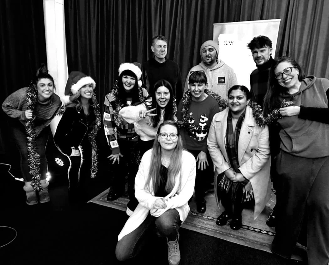 Kay from Sing with Kay with vocal bootcamp students in Leicester, smiling and celebrating at Christmas