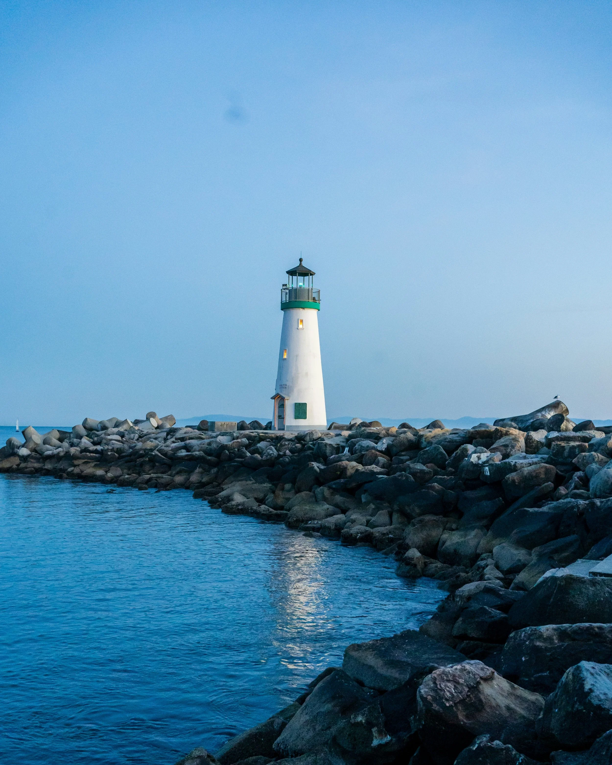Coastal Lighthouse give guidance blue sky and clear sea