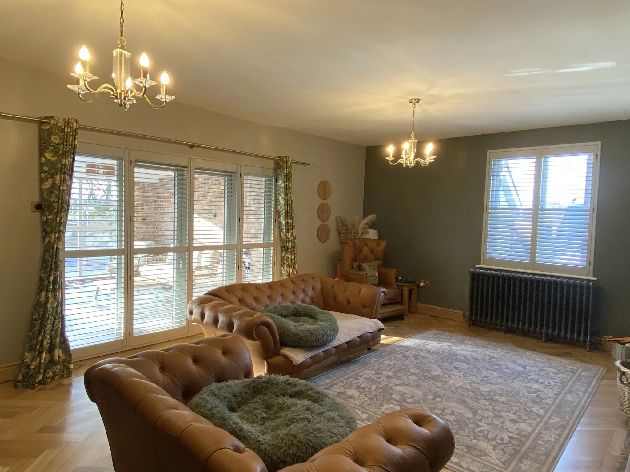 Custom colour Hardwood Shutters fitted to a Living room in Glazebury