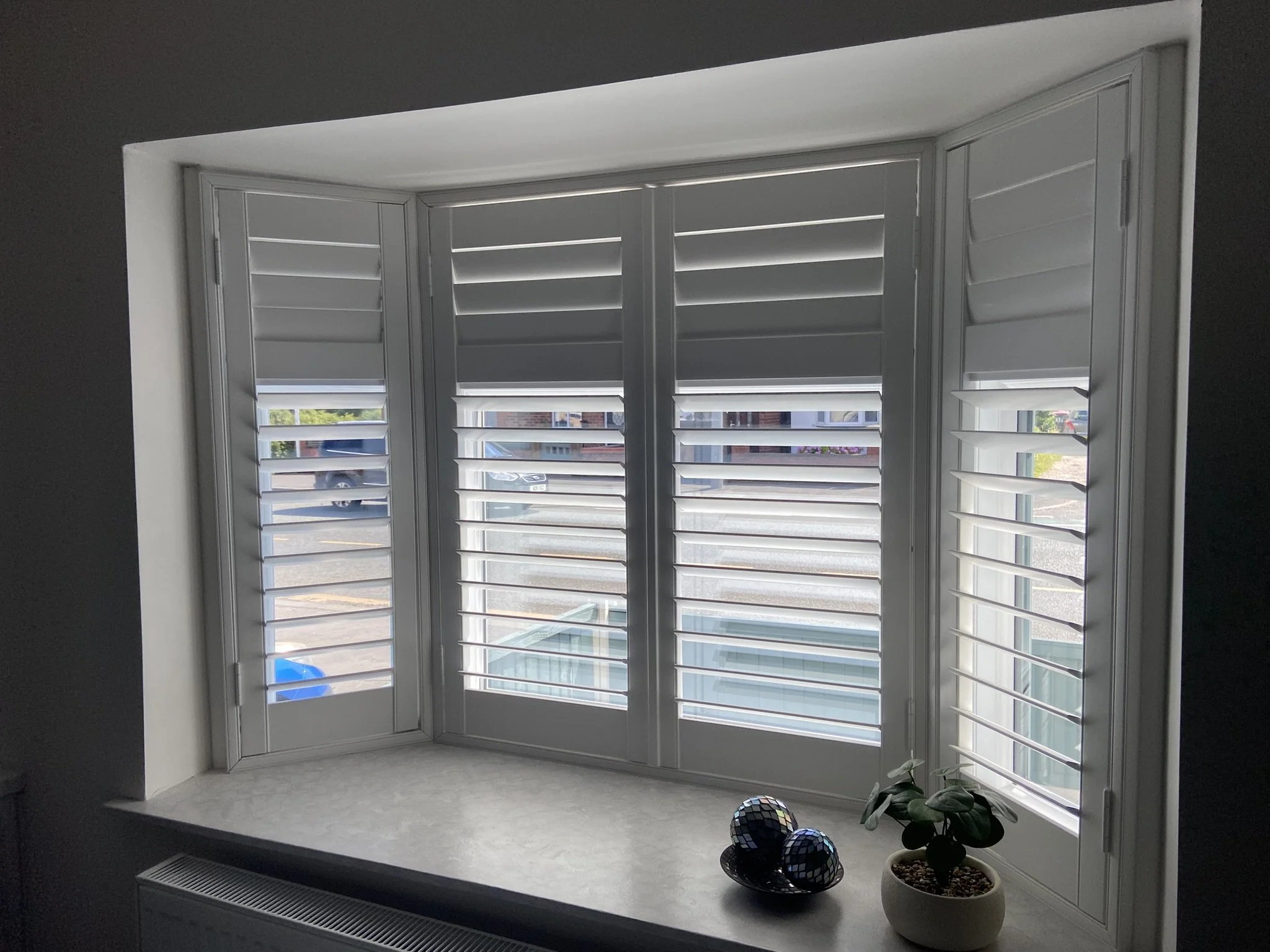Bay window shutters fitted in a home in Tyldesley