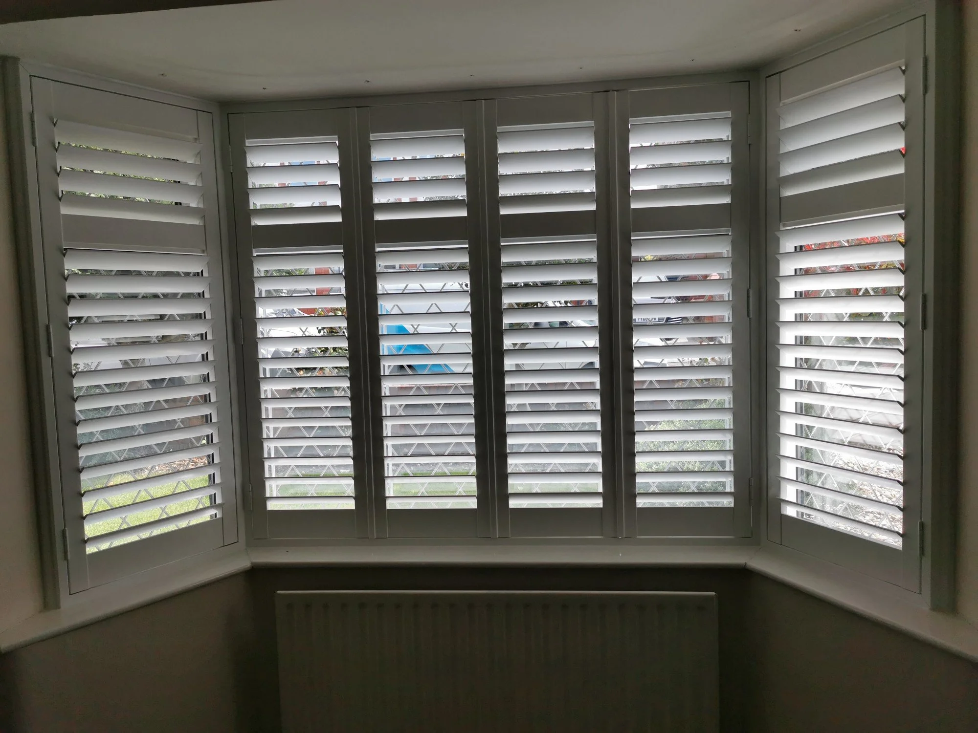 PVC Shutters fitted to a Large Bay window in Astley