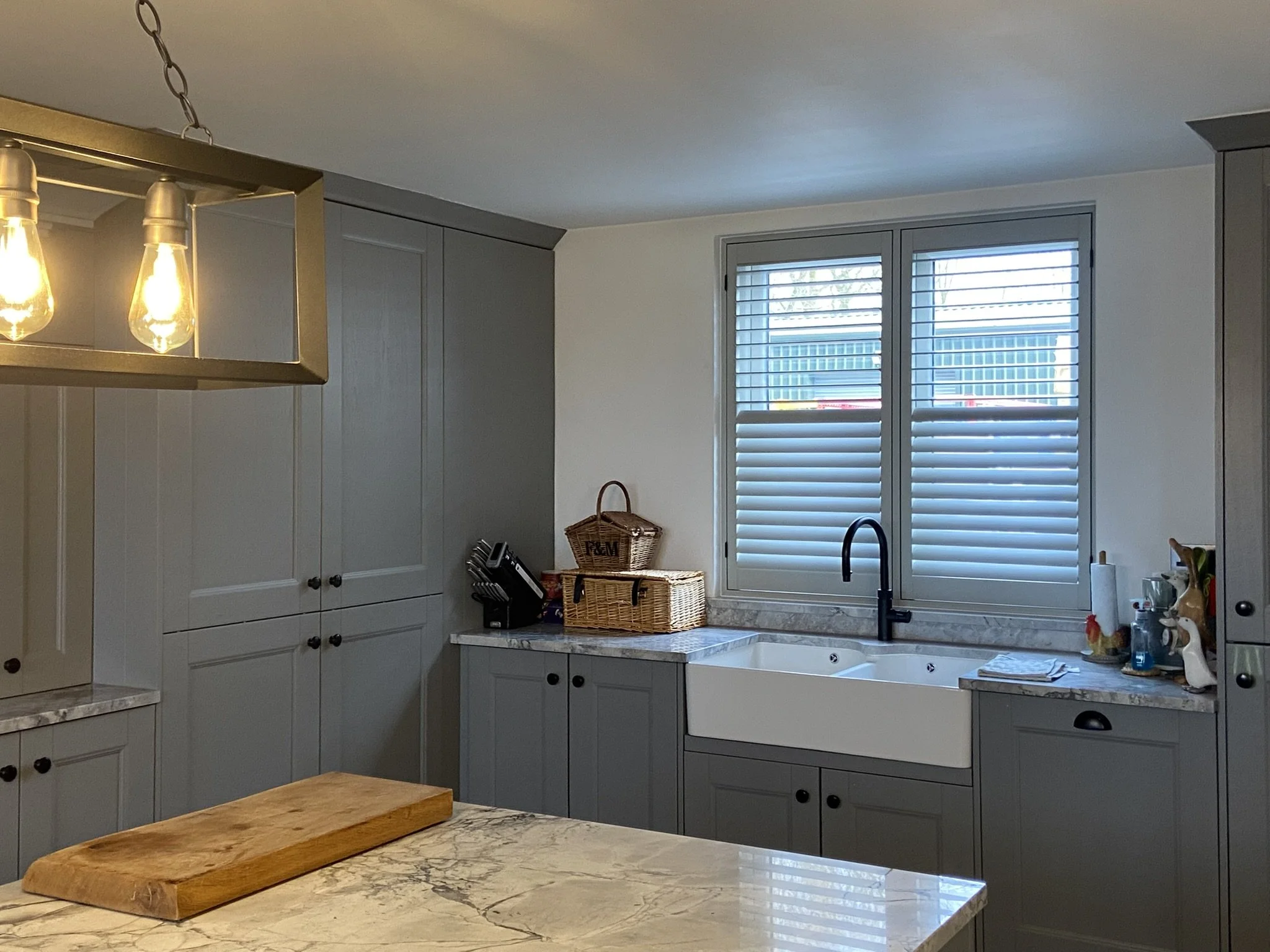 Custom colour Hardwood Shutters fitted to a Kitchen in Glazebrury