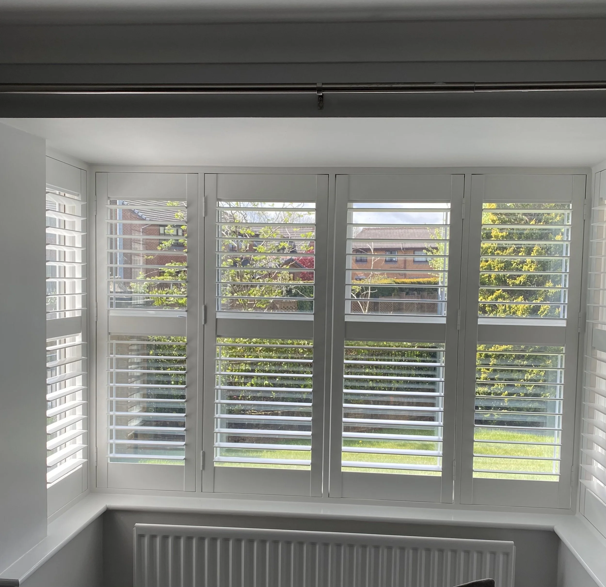 UK-made shutters fitted to a Bay window in Ellenbrook